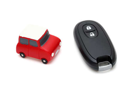 car black key remote controller and small toy carの写真素材