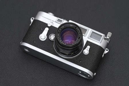 Kagawa, Japan - February 27, 2022: Leica M3 rangefinder camera with Leitz 50mm f2 Summicron M-mount lens. Vintage collectible classic lens concept.のeditorial素材
