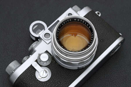 Kagawa, Japan - February 27, 2022: Leica â¢G rangefinder camera with Leitz 50mm f1.4 Summilux L-mount lens. Vintage collectible classic lens concept.のeditorial素材