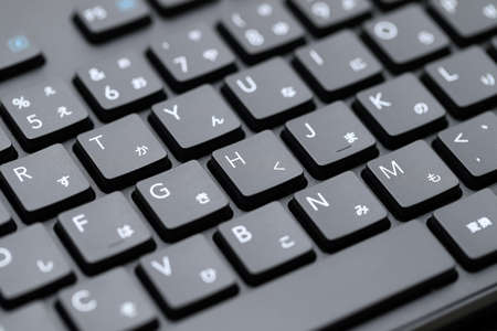 Close up of computer keyboard. Alphabetics and Japanese hiragana typing keyboard.の写真素材