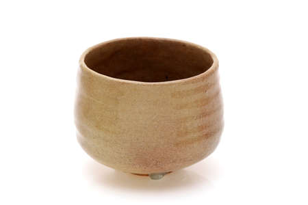 Single tea bowl used in Japanese matcha tea ceremony on white backgroundの写真素材