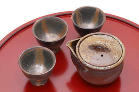 Japanese green tea in a tea set with cup and pot on wooden trayの写真素材