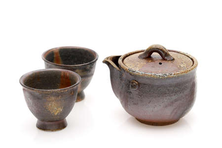 Japanese green tea in a tea set with cup and pot isolated on a white backgroundの写真素材