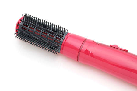 Photo of hair dryer color pink isolated on white backgroundの写真素材