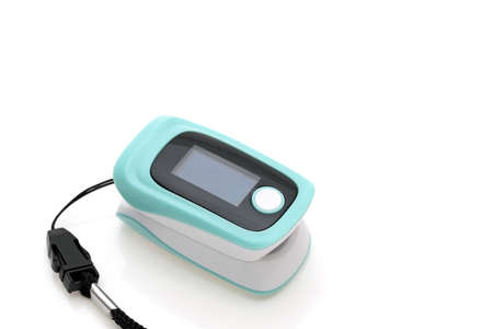 Pulse oximeter device on white background, healthcare monitoring conceptの写真素材