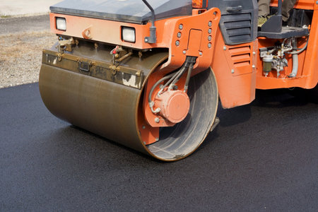 Heavy vibratory road roller close-up. Repaving the road surface. Road worksの写真素材