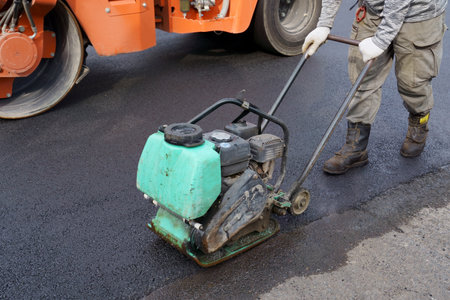Heavy vibratory road roller close-up. Repaving the road surface. Road worksの写真素材