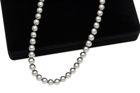 Elegant black pearl necklace on white backgroundの写真素材