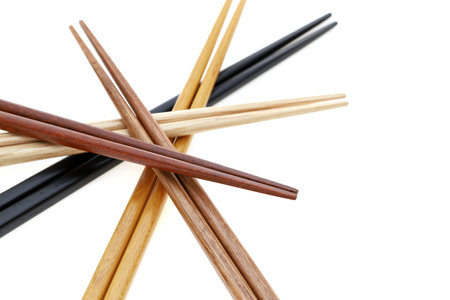 Pile of wooden chopsticks isolated on white backgroundの写真素材