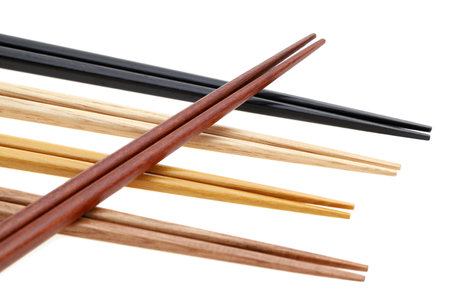 Pile of wooden chopsticks isolated on white backgroundの写真素材