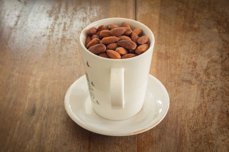 almonds in white ceramic glassの写真素材