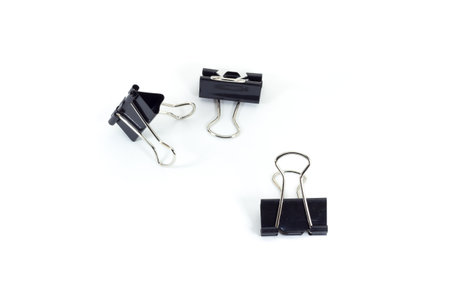 black paper clip on white isolate backgroundの写真素材