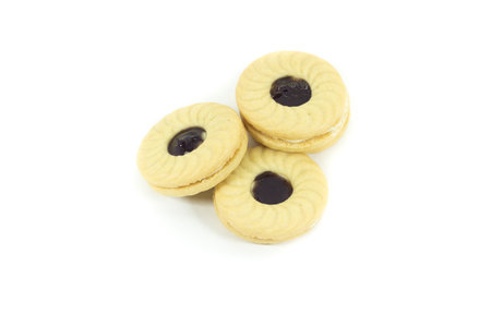 Butter cookies with blueberry jam isolated on a white backgroundの写真素材