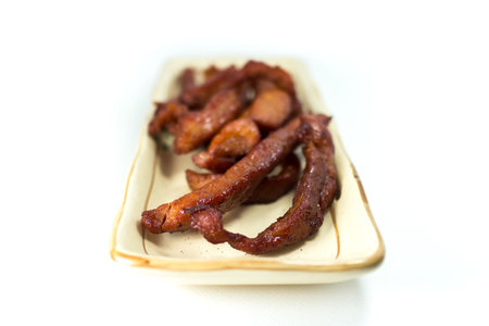 Fried pork with pepper and herbの写真素材