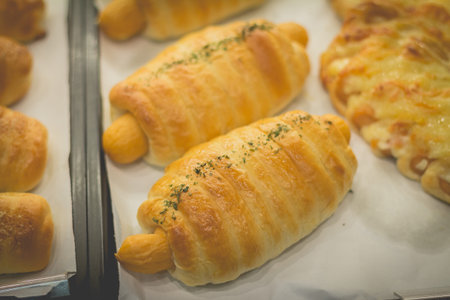 Retro effect faded image of delicious sausage bread