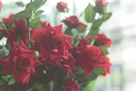 Retro effect faded image of artificial flowers rose and vintage themeの写真素材