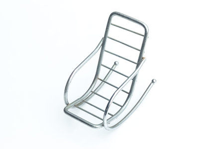A little chair for put mobile phone that have a modern designmade by aluminium wireの写真素材
