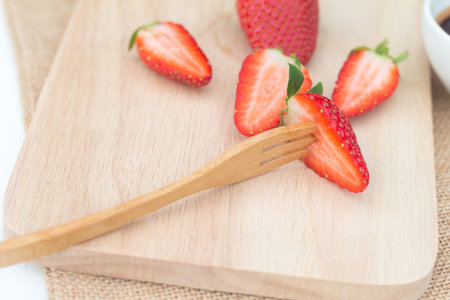 Fresh and delicious strawberry on rustic wooden plate. soft focusの写真素材