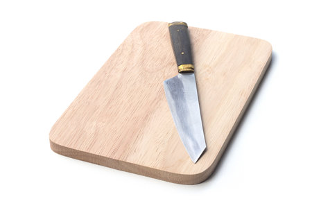 knife on wood plate and isolated on white backgroundの写真素材