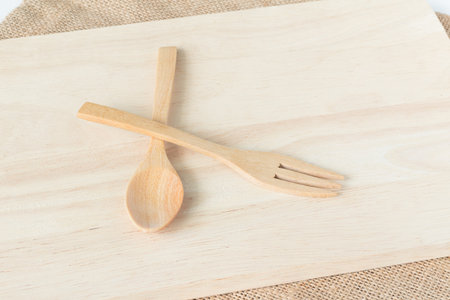 wood plate for serving food and wood spoon and forkの写真素材