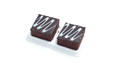 Fresh chocolate brownies isolates on white backgroundの写真素材