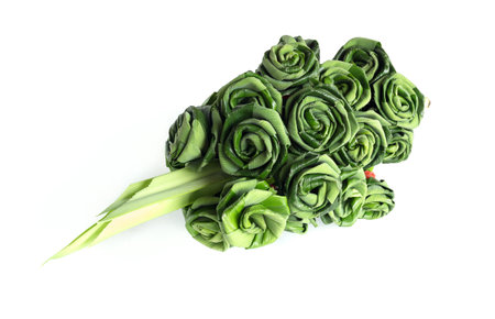 Fresh Pandanus leaf weave to rose bouquet isolated on white backgroundの写真素材