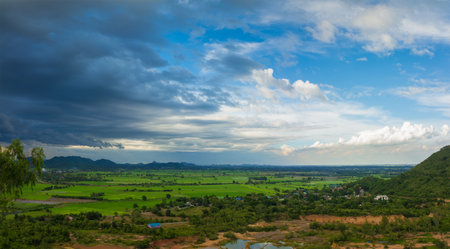 Thailand landscape of rural city and moutain under the blue sky but the strom is coming.の写真素材