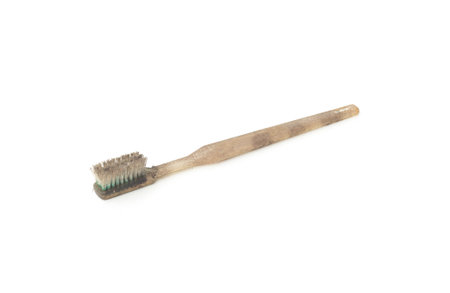 Dirty and worn out toothbrush isolated on white backgroundの写真素材