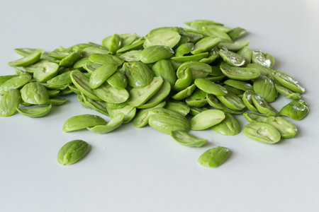 The fresh Parkia on white background  which is tropical stinking edible beans, Thailandの写真素材