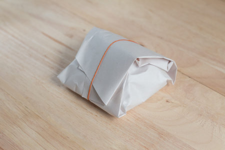 The package of Thai food that wrap by paper which is popular method for packaging form street food vendor.の写真素材