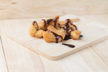 Chinese Traditional Snacks Deep Fried Doughstick Pa Tong Go that serve with sweetened condensed milk and chocolate syrup.soft focusの写真素材