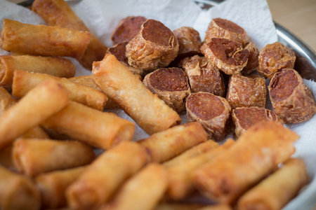 Deep fried spring rolls and deep fried chicken rolls that ready for servingselective focus