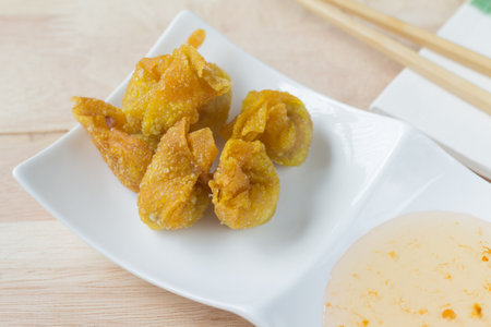 Deep fried dumpling or wonton with pork stuffed. This is popular food in asian countryの写真素材