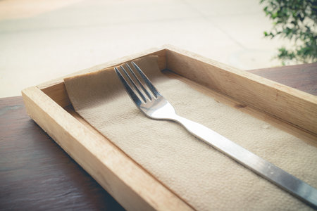 stainless fork in the wooden box(vintage theme)の写真素材