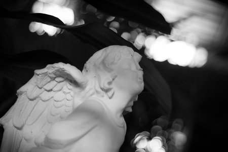Statue of a beautiful child in black and white color. Little angle statue in black and white color.