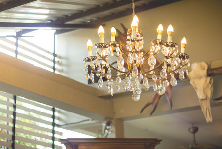Home interiors Chandelier on ceiling. Vintage chandelier. Luxury chanderlier for home decoration.(turn on the light)の写真素材