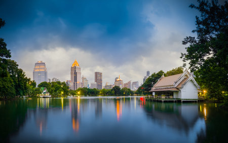 Bangkok Thailand - september 04 2016: evening scene of Bangkok skyline at Lumphini Park in Bangkok. Lumphini Park is a park in Bangkokのeditorial素材