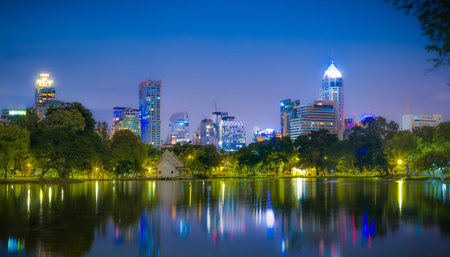 Bangkok Thailand - september 04 2016: evening scene of Bangkok skyline at Lumphini Park in Bangkok. Lumphini Park is a park in Bangkokのeditorial素材