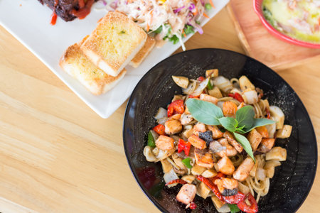 spicy herbal spaghetti with smoked salmon meat(selective focus)の写真素材