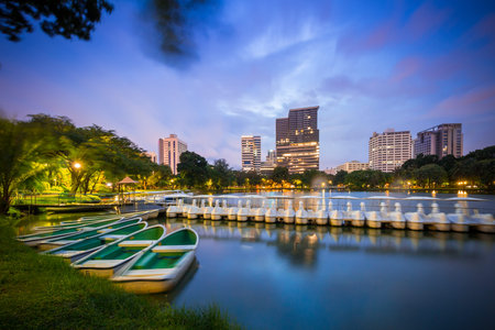 Bangkok Thailand - september 04 2016: evening scene of Bangkok skyline at Lumphini Park in Bangkok. Lumphini Park is a park in Bangkokのeditorial素材