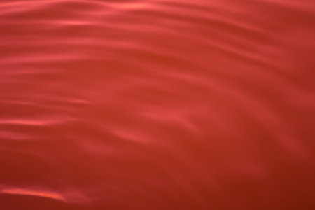 red color abstract background of liquid wave based on water waveの写真素材