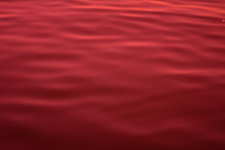 Red color abstract background of liquid wave based on water waveの写真素材