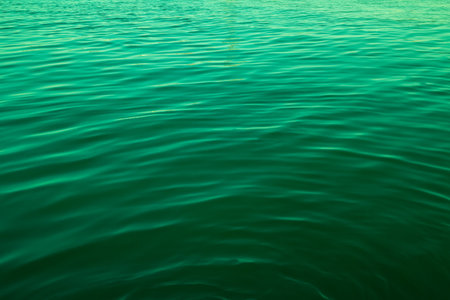 Green color abstract background of liquid wave based on water waveの写真素材
