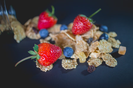 whole grain cereal flakes which mixed berry fruit and raisinsの写真素材