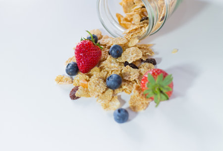 whole grain cereal flakes which mixed berry fruit and raisinsの写真素材