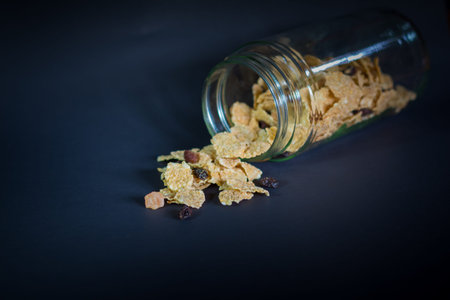 whole grain cereal flakes which mixed dried fruit and raisinsの写真素材
