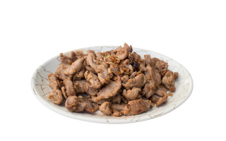 Fried pork with garlic and pepper isolated on white backgroundの写真素材