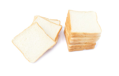 picture of sliced soft and sticky delicious white bread for breakfast on white isolated backgroundの写真素材