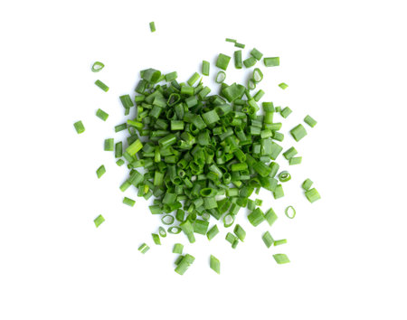 picture of Chopped green onions or scallions placed on white backgroundの写真素材