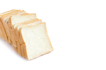 picture of sliced soft and sticky delicious white bread for breakfast on white isolated backgroundの写真素材